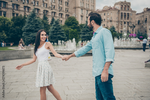 Profile side view photo of charming pretty lovely people promenade cheerful candid enjoy free time voyage tour wear dress white blue denim jeans shirt bearded © deagreez