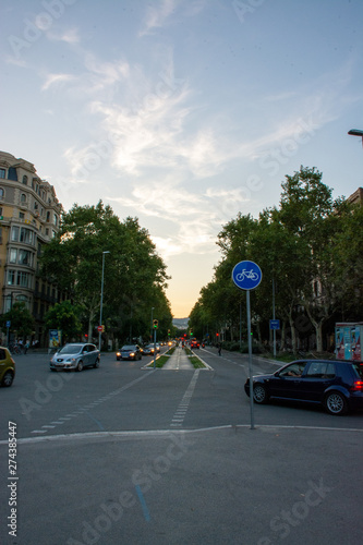 Barcelona, Spain - 26th July 2017 - People or tourists walking through a long alley to the shops