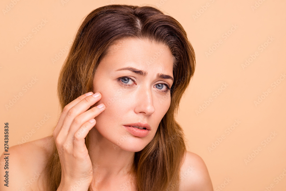 Close up photo beautiful amazing mature she her lady crying oh no facial expression hold hands arms cheek cheekbone terrible result using cream wrinkled more nude isolated pastel beige background Close up photo beautiful amazing mature she her lady crying oh no facial expression hold hands arms cheek cheekbone terrible result using cream wrinkled more nude isolated pastel beige background