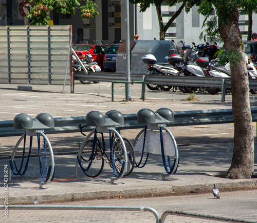 Barcelona, Spain - 27th July 2017 - Bike rack with helmet stand in