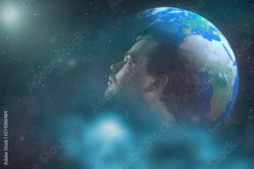 Human looking in infinity space galaxy. Earth background. Mixed media. photo