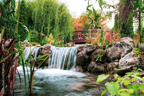 Fototapeta Naklejka Na Ścianę i Meble -  magnificent small waterfall in the garden