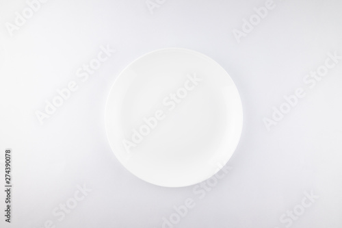 Empty white plate isolated on white background. diet concept.