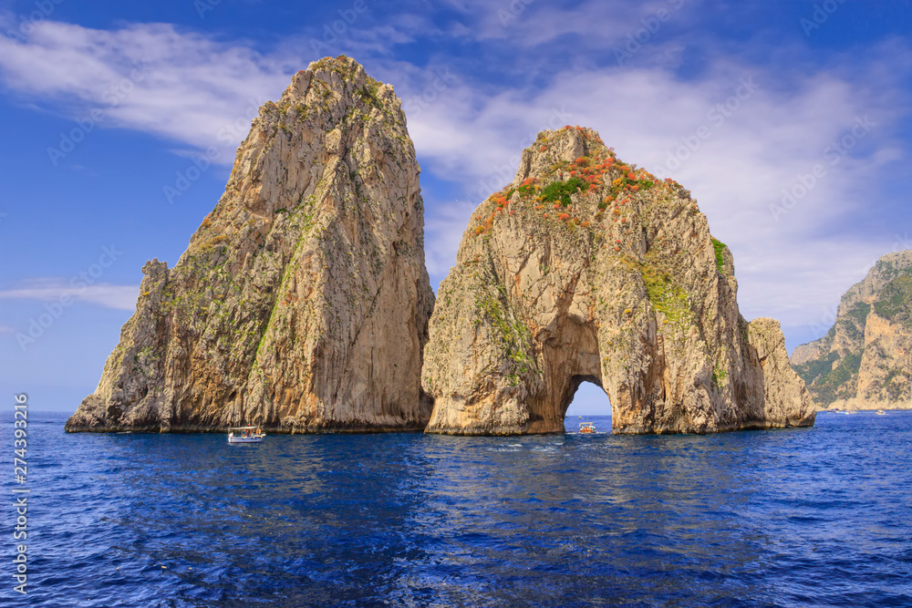 The Faraglioni Rocks on the coast of the island of Capri, Italy. Capri stacks, the symbol of the island, located in the gulf of Naples, Campania.