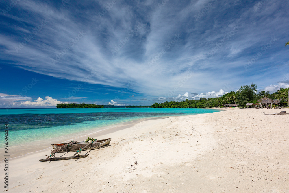 Port Orly sandy beach with palm trees, Espiritu Santo Island, Vanuatu.