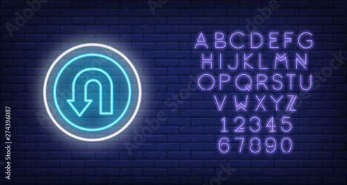Reversal road neon sign. Glowing illustration of circle road sign with reversal arrow on blue brick background. Can be used for roads, road works, warnings