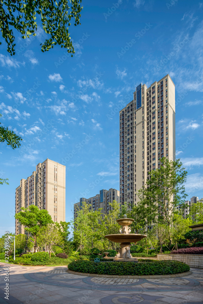 Fototapeta premium Garden Landscape and Green Lawn in Gardens of Modern High-rise Residential Quarters