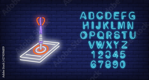 Arrow in mobile neon sign. Illustration of dart arrow in mobile target on dark blue brick background. Can be used for topics like games, advertisement, entertainment