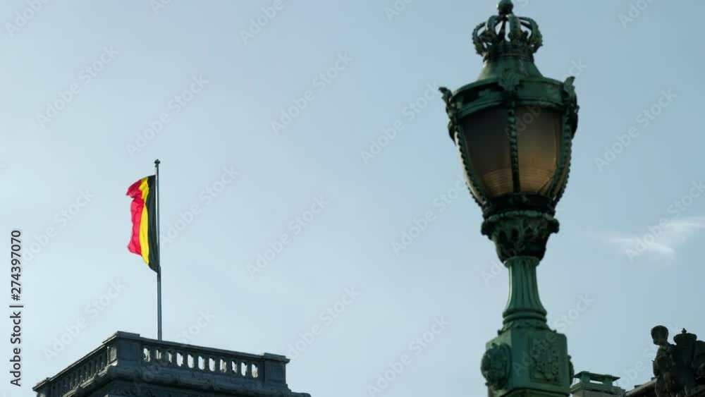The flag of Belgium flying above the Royal Palace in Brussels The flag of Belgium flying above the Royal Palace in Brussels