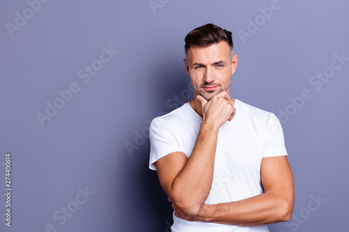 Close up photo amazing he him his middle age macho perfect appearance hand arm chin look pensive ponder doubtful unsure uncertain funny playful mood wear casual white t-shirt isolated grey background