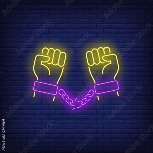 Hands in manacles with broken chain neon sign. Justice, prisoner, enforcement design. Night bright neon sign, colorful billboard, light banner. Vector illustration in neon style.