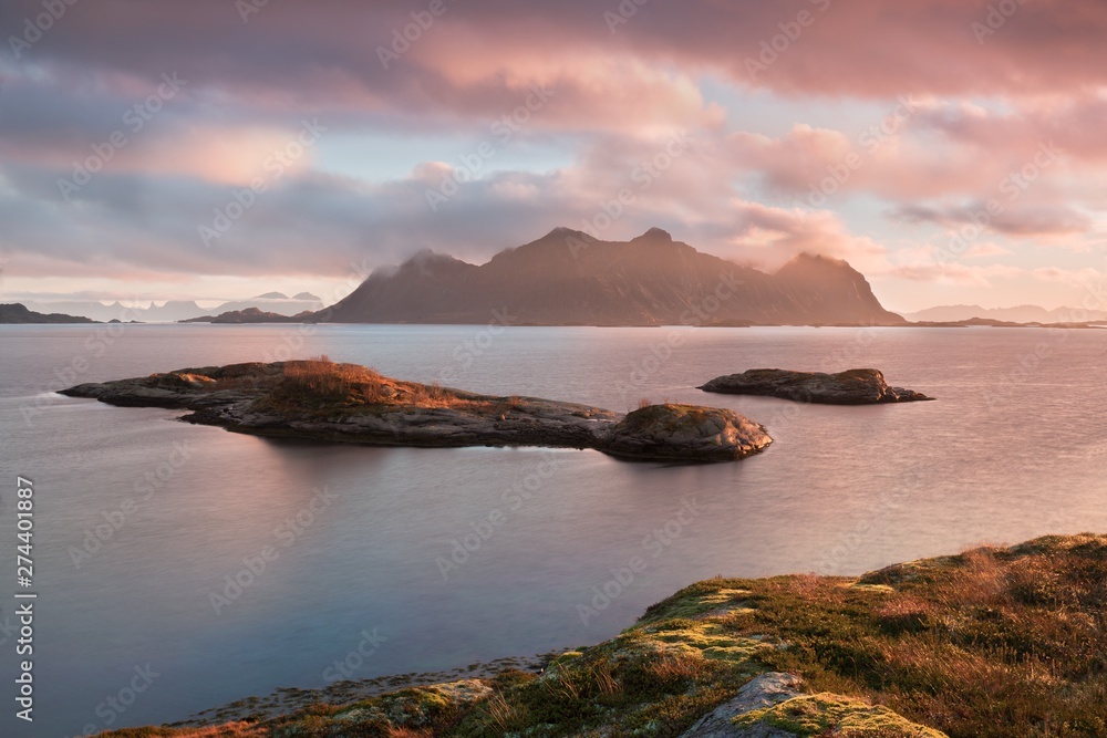 Sunset on Most Scenic Beaches Beautiful landscape of Vestvagoy in the evening, dramatic pink sky, part of Lofoten island, Arctic Circle, Nordland, Norway, Scandinavia