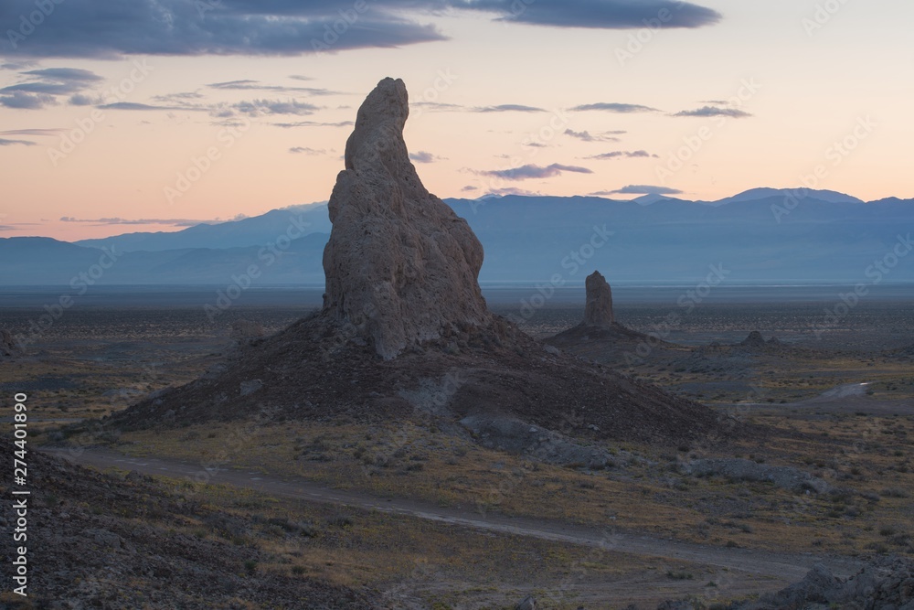 Trona Pinnacles are nearly 500 tufa spires hidden in California Desert National Conservation Area, not far from the Death Valley National Park, California, USA. Sunset landscape with beautiful rocks.