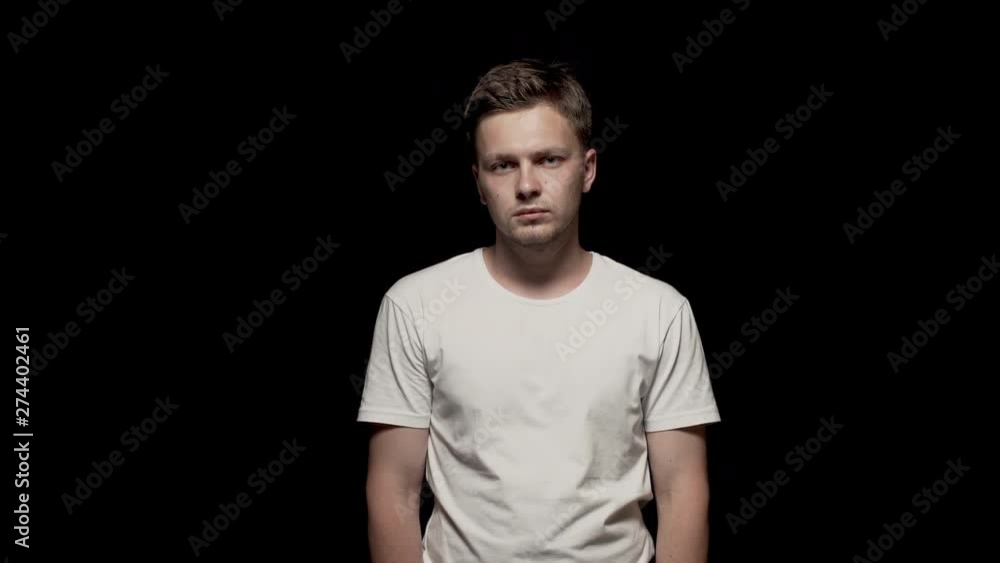 Caucasian man rotating head right to left. Black background. Caucasian man rotating head right to left. Black background.