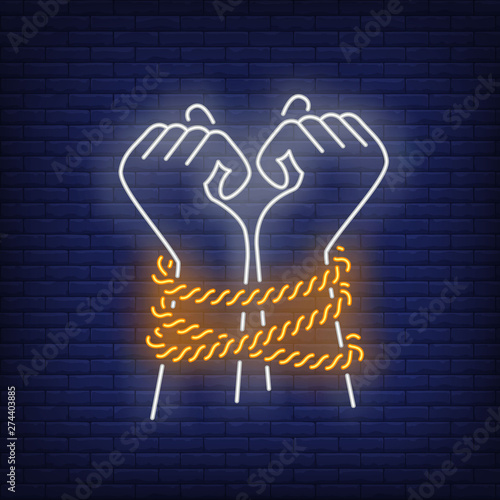 Tied hands neon sign. Justice, prisoner, enforcement design. Night bright neon sign, colorful billboard, light banner. Vector illustration in neon style.
