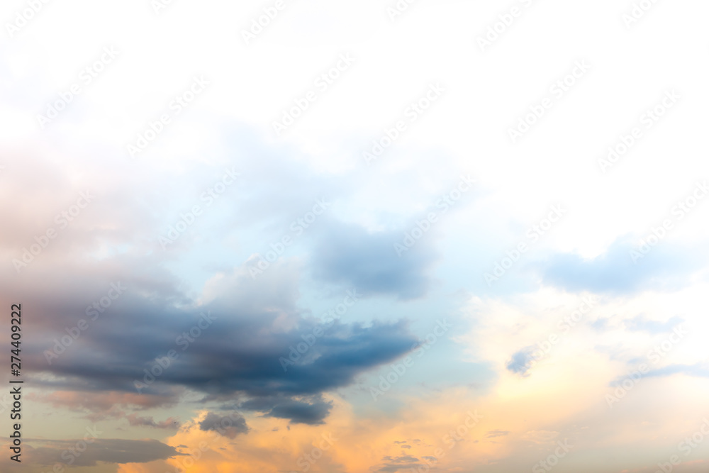 Sunset sky with blue and orange clouds background.