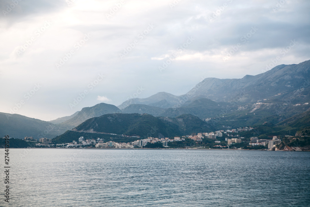 Beautiful views of the mountains, the sea and the city of Budva in Montenegro. The city is among the natural landscape.