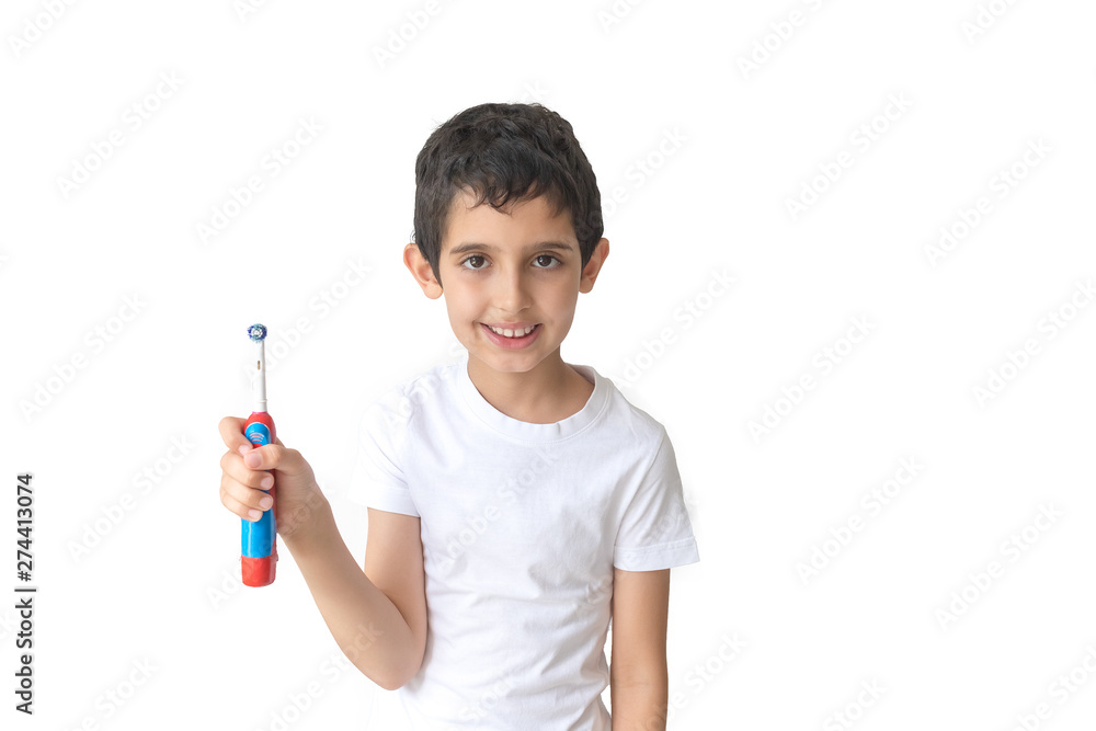 Portrait of young boy holding toothbrush looking a camera. Teenager. Portrait of young boy holding toothbrush looking a camera. Teenager.