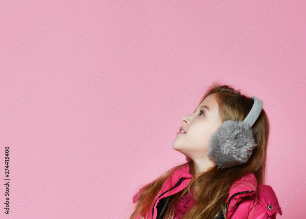 Cute smiling girl in fur headphones
