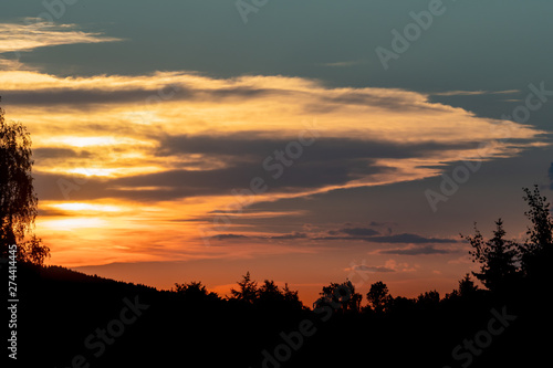 Romantic sunset with dramatic sky © sandradombrovsky