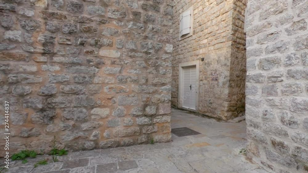 Ancient houses and narrow streets in old town of Budva, Montenegro. Ancient houses and narrow streets in old town of Budva, Montenegro.