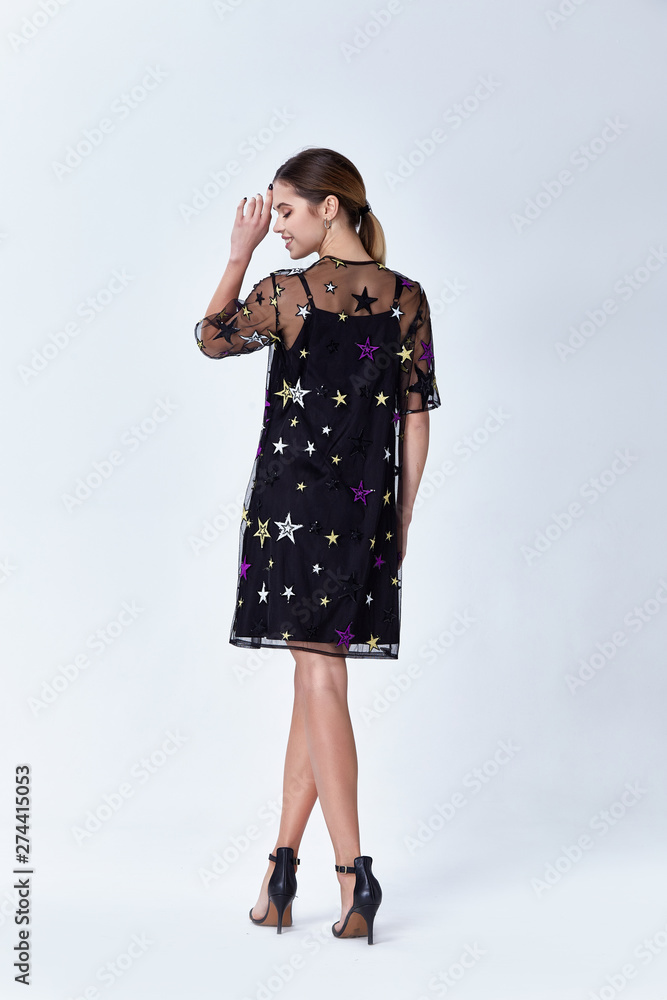 Beautiful sexy young business woman blond hair with evening make-up wearing a dress suit top and high-heeled shoes business clothes for meetings and walks autumn collection perfect body shape. Beautiful sexy young business woman blond hair with evening make-up wearing a dress suit top and high-heeled shoes business clothes for meetings and walks autumn collection perfect body shape.