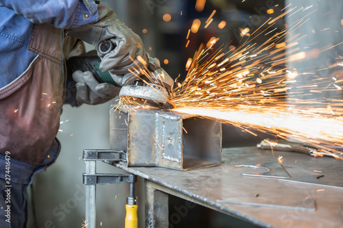 Grinding of materials in metallurgy workshop