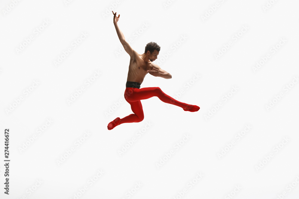 Graceful classic ballet dancer dancing isolated on white studio background. Man in bright red clothes like a combination of wine and milk. The dance, grace, artist, movement, action and motion concept