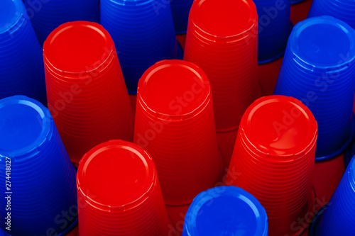 Plenty of plastic empty colorful cups close up