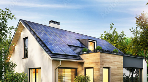 Solar panels on the gable roof of a modern house photo