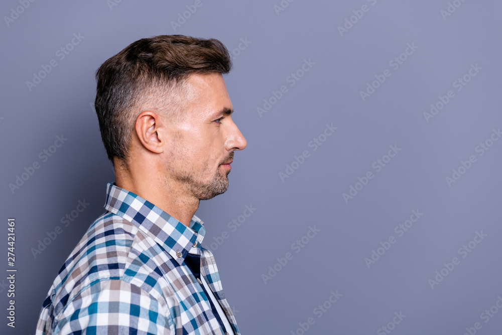 Close-up profile side view portrait of his he nice attractive calm bearded guy wearing checked shirt copyspace isolated over gray blue violet purple pastel background Close-up profile side view portrait of his he nice attractive calm bearded guy wearing checked shirt copyspace isolated over gray blue violet purple pastel background
