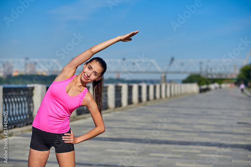 Fitness young woman stretching hands after run. outdoors after run © Joe-L