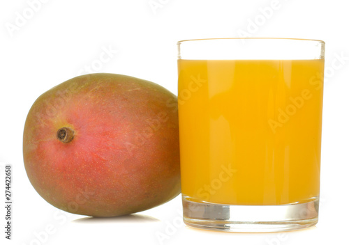 Ripe fresh mango fruit and mango juice in a glass on a white isolated background. tropical fruit