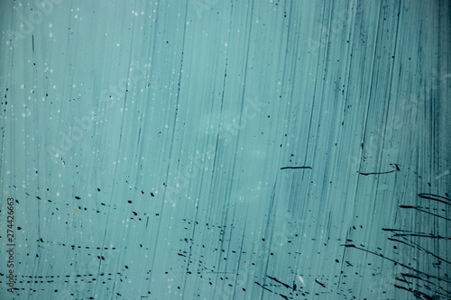 Teal painted glass streak background photo