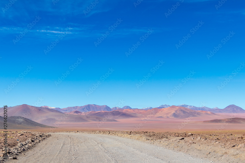 Naklejka premium Background with barren desert scenery in the Bolivian Andes, in the Nature reserve Edoardo Avaroa