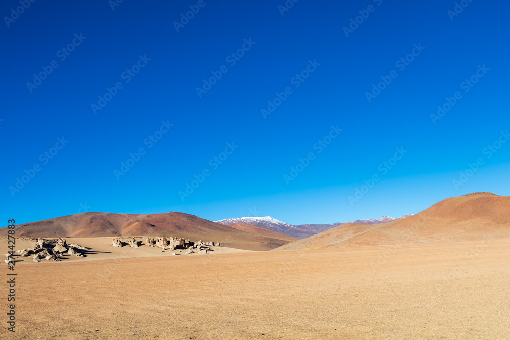 Background with barren desert scenery in the Bolivian Andes, in the Nature reserve Edoardo Avaroa