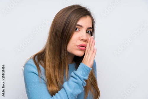 Young girl with blue sweater whispering something
