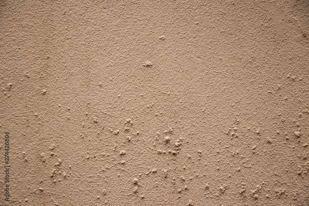 Beige painted grunge wall rough texture Beige painted grunge wall rough texture