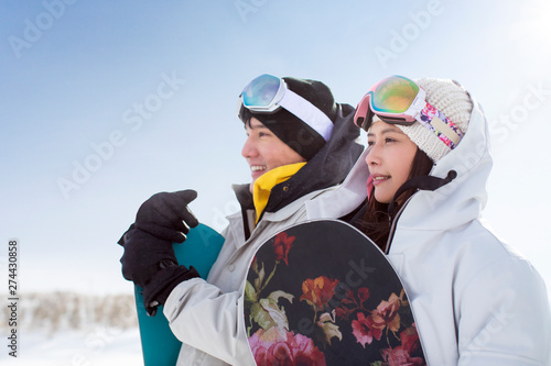 Young couple skiing in ski resort