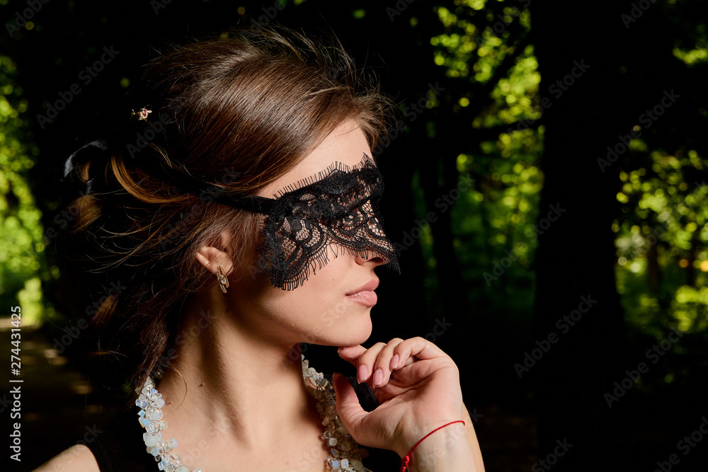 Beautiful female wearing a venetian mask - Playground