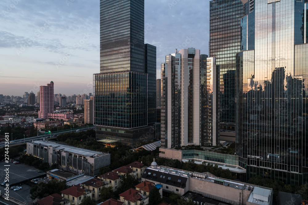 Fototapeta premium Aerial view of business area and cityscape in the dawn, West Nanjing Road, Jing` an district, Shanghai