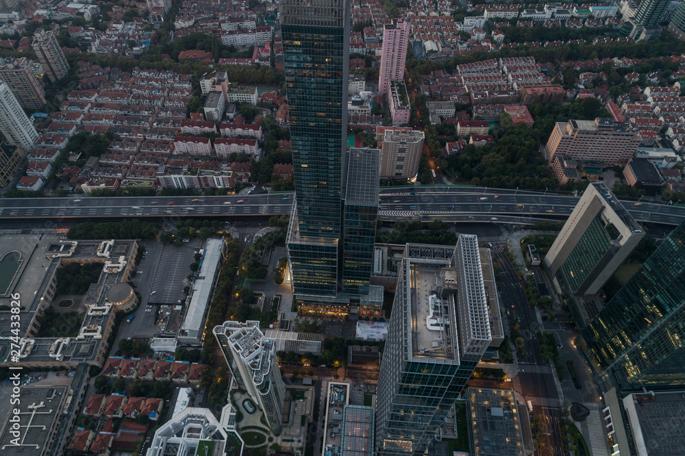 Obraz premium Aerial view of business area and cityscape in the dawn, West Nanjing Road, Jing` an district, Shanghai