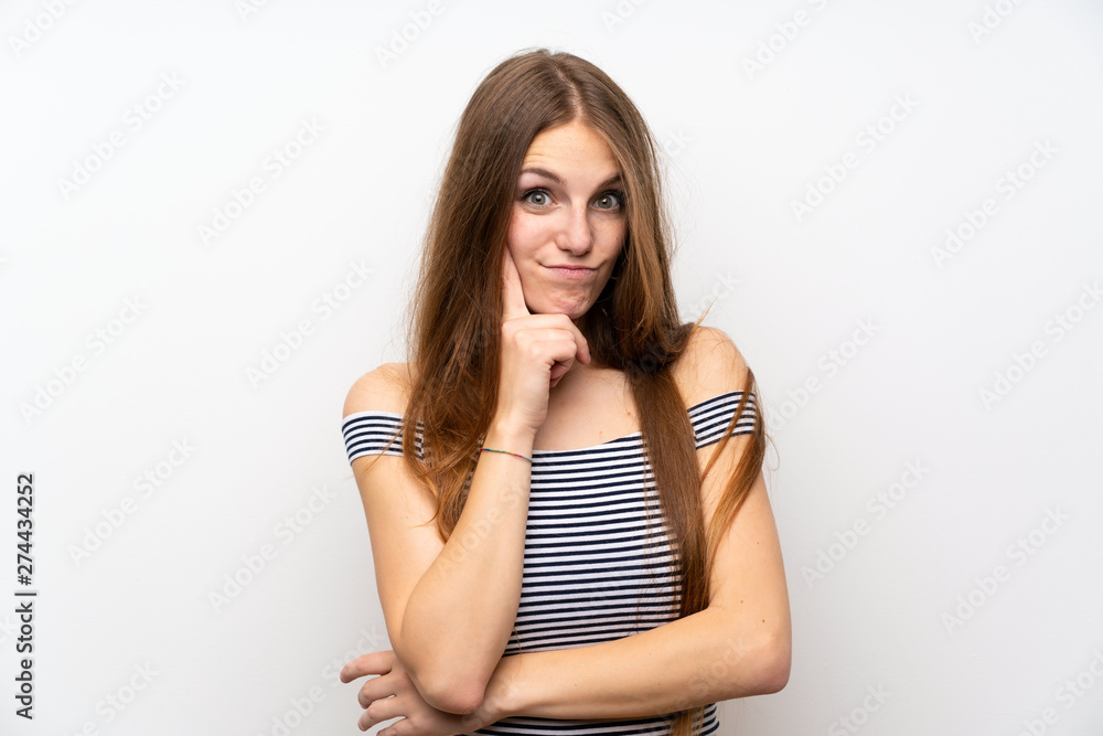 Young woman with long hair over isolated white wall Looking front Young woman with long hair over isolated white wall Looking front