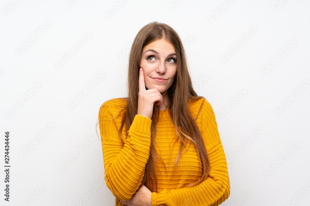 Young woman with yellow over isolated white wall thinking an idea Young woman with yellow over isolated white wall thinking an idea