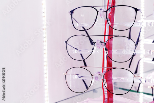 Optics store, set of glasses in shop windshield, medetsin. Place for text.