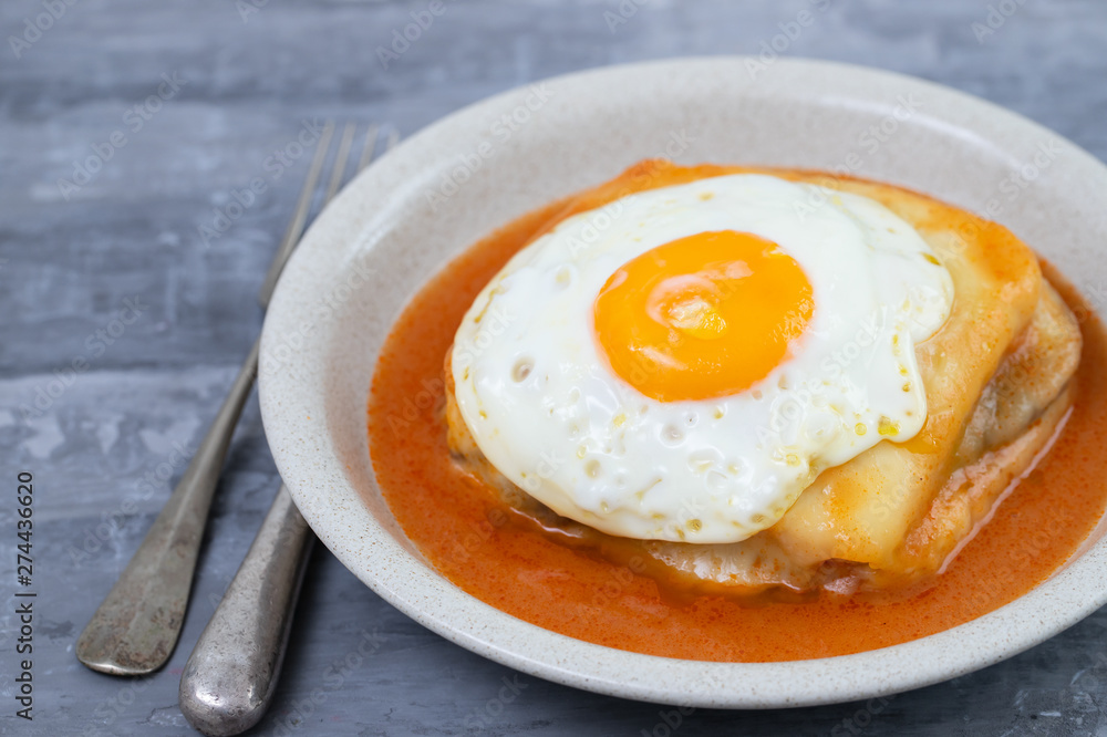 typical portuguese dish francesinha in dish on ceramic background typical portuguese dish francesinha in dish on ceramic background