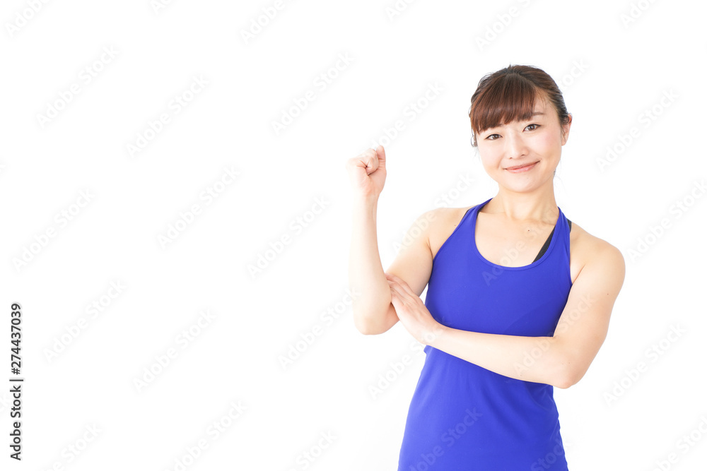 筋肉を鍛えるスポーツウェアを着た女性 筋肉を鍛えるスポーツウェアを着た女性