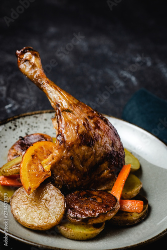 Roasted Chicken Leg with Potatoes, Carrots and Oranges