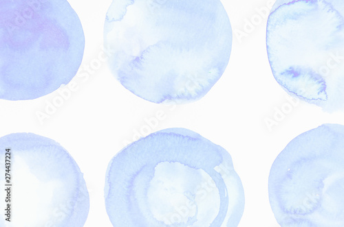 Blue liquid color blobs painted on white canvas