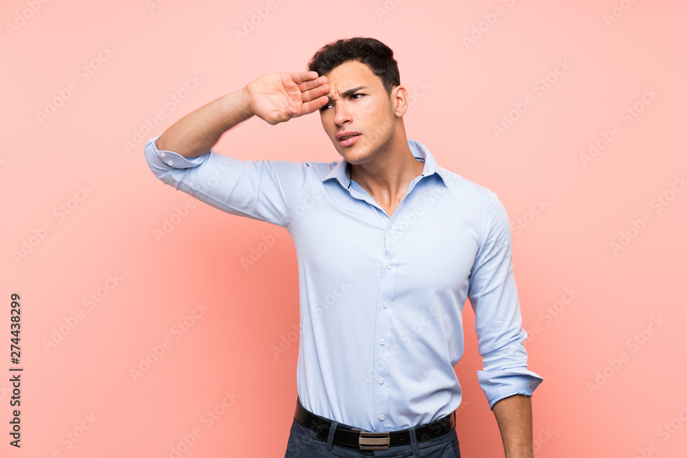 Handsome man over pink background with tired and sick expression Handsome man over pink background with tired and sick expression